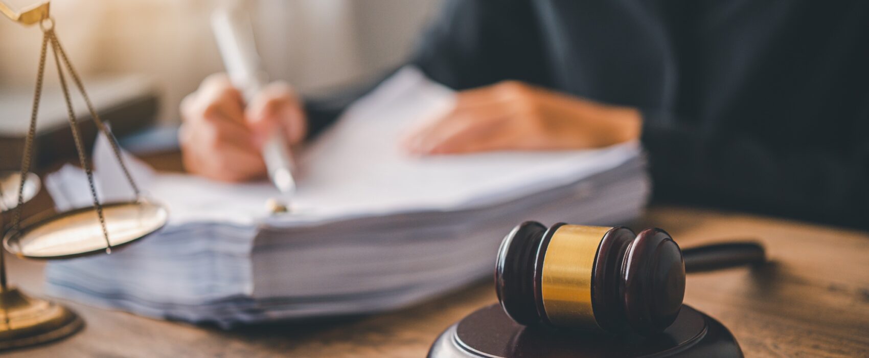 Law theme, mallet of the judge, law enforcement officers. Legal translation services.